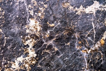 Gray porcelain tiles with beige and orange spots. Background and texture of colored porcelain stoneware.