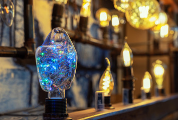 Light bulb with a multi-colored LED garland inside.