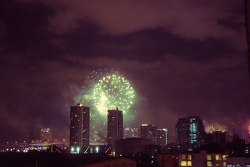 fireworks on Bangkok city skyline new years eve celebration