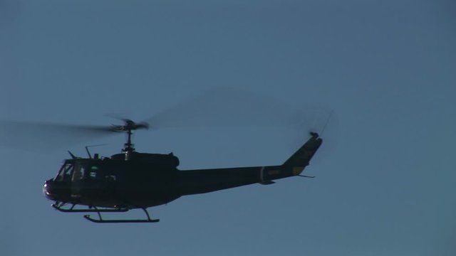 Military helicopter flying low overhead