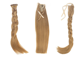 Set of multiple fake women hair extensions in tails, isolated on white background. Dark blonde or brown color. and different attachment types.