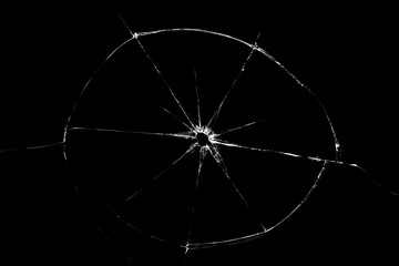 Broken glass texture with hole in center isolated on black background