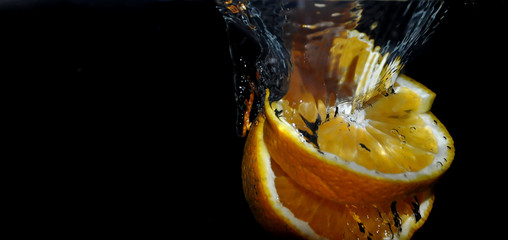 Fototapeta na wymiar Orange Splash in Water