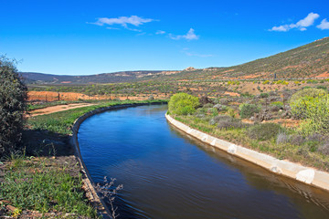 Fototapeta na wymiar Wide irrigation canal on Oliphants River