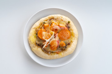 Pizza Cheese with Shrimp, Pork, Imitation Crab Stick and Salted Eggs on White Dish Wood Table.