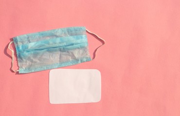 Medical Face Mask on Pink Background with Copy Space