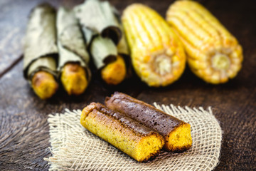 Broa made with corn and wrapped in banana leaf. Corn bread made for the June and July parties in Brazil. Brazilian cuisine.