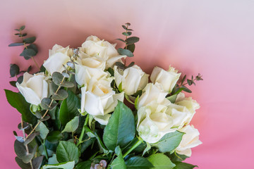 Close Up Of Little Bouquet Made Of White Rose Flowers On A Pink Gradient Background With Copy Space