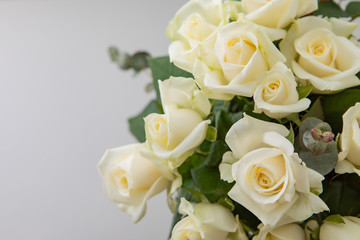 Close Up Of Little Bouquet Made Of White Rose Flowers On A White Paper Background With Copy Space