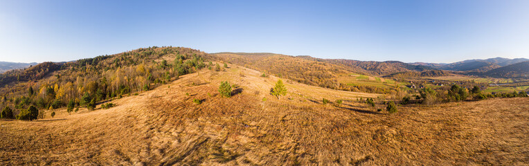 Aerial drone view 180 degrees panoramic scenic landscape of mountains and forests, slopes and valleys. Carpathians, Eastern Beskids