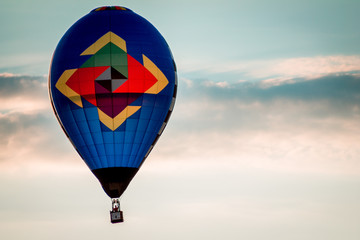 Hot air balloon floating by during a beautiful sunset during an airshow in Michigan