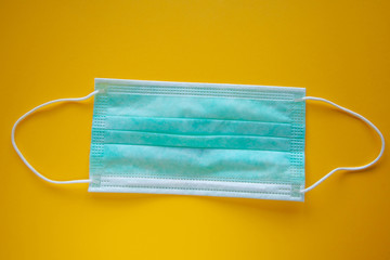 Coronavirus or covid19 microbe protection mask and gloves or hand sanitizer for hand washing, fever monitor for doctors and hospital in isolated on yellow background.