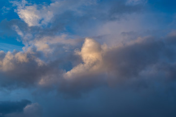 Naklejka na ściany i meble rain Cumulus clouds in a blue sky