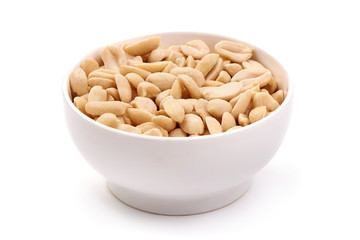 Processed peanuts in a bowl, isolated on white background