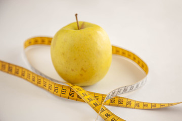 Green apples measured the meter.Healthy food for weight loss.
