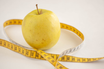 Green apples measured the meter.Healthy food for weight loss.
