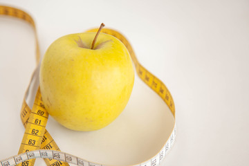 Green apples measured the meter.Healthy food for weight loss.
