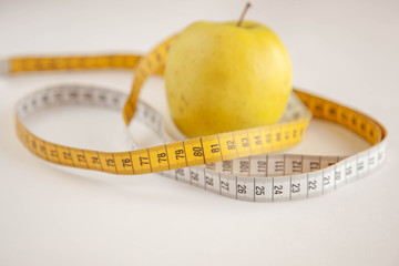 Green apples measured the meter.Healthy food for weight loss.
