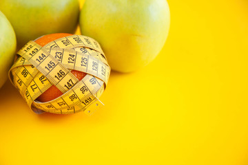 Green apples measured the meter. Healthy food for weight loss.