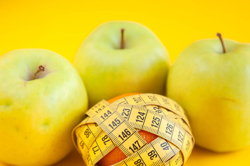 Green apples measured the meter. Healthy food for weight loss.