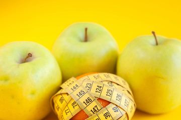 Green apples measured the meter. Healthy food for weight loss.