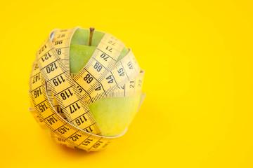 Green apples measured the meter. Healthy food for weight loss.