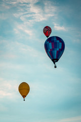 Sunset full of hot air ballons flying in the sky in Michigan