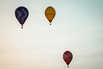 Sunset full of hot air ballons flying in the sky