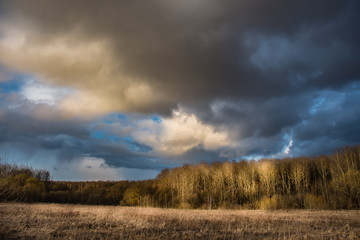 Fototapeta na wymiar evening landscape with rain Cumulus clouds
