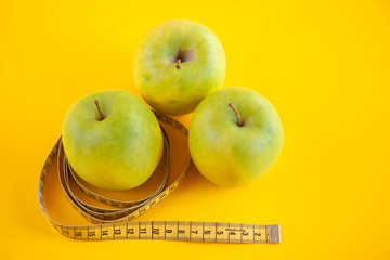 Green apples measured the meter. Healthy food for weight loss.