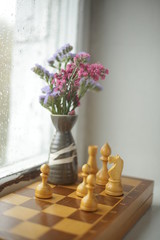 a bouquet of flowers on a chessboard
