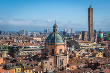 Old town of Bologna city, Italy seen from terrace of St Petronius basilica, view with Two Towers and dome of Santa Maria della Vita church