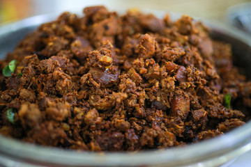 Kerala style beef dry fry. delicious spicy Beef fry in banquet table with chafing dish heaters. It goes well with ghee rice, kappa,appam, parotta, puttu, Kerala style cuisine ,beef roast.India