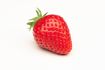 A single red strawberry on a white background