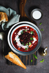 Traditional Ukrainian soup borscht with red beans and sour cream
