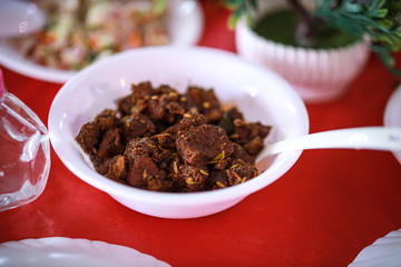 Kerala style beef dry fry. delicious spicy Beef fry in banquet table with chafing dish heaters. It goes well with ghee rice, kappa,appam, parotta, puttu, Kerala style cuisine ,beef roast.India