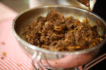 Kerala style beef dry fry. delicious spicy Beef fry in banquet table with chafing dish heaters. It goes well with ghee rice, kappa,appam, parotta, puttu, Kerala style cuisine ,beef roast.India