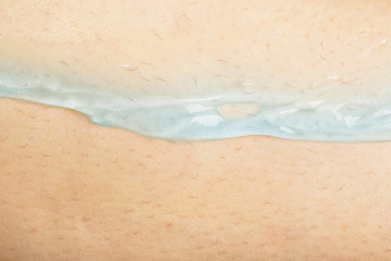 Fototapeta na wymiar Shaving preparation. Application of shaving gel on the skin, macro