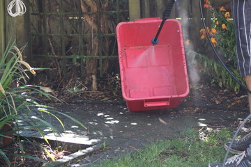 jet washing the wheely bin 