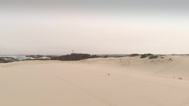 Aerial Cranes Down Over Sand Dunes In Cronulla, Australia. Wide Shot