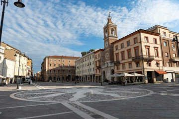 Rimini, Emilia-Romagna/ Italy-May 31, 2019: Empty central square of Rimini, Italy. The area of the Three Martyrs with an ancient clock tower.
