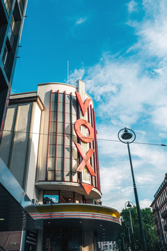 Strasbourg, France - July 22, 2017: Vox cinema movie theater in central Strasbourg with large red neon letters and clear blue sky