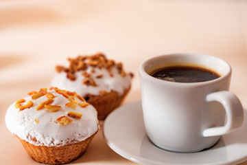 Dessert coffee with Muffins on light table. Close up.