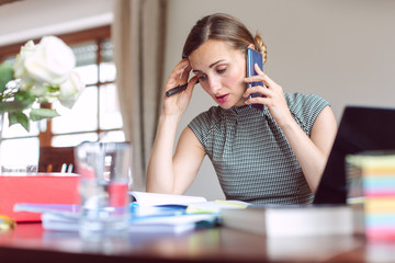 Businesswoman working from home during crisis being stressed