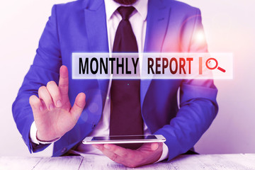 Text sign showing Monthly Report. Business photo showcasing An assessment that takes place during a project or process, Businessman with pointing finger in front of him