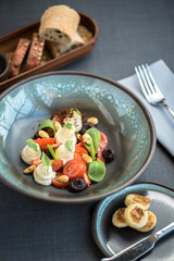 Mozzarella cheese salad with tomatoes, vegetables
