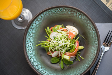 Salmon salad with fresh vegetables, cucumber