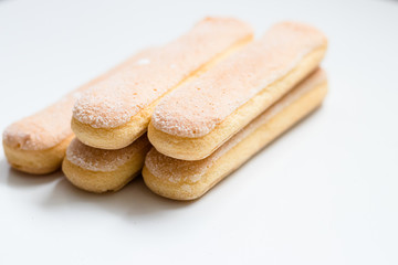Fototapeta na wymiar Sponge biscuit - ladyfinger savoiardi isolated on white background
