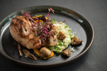 Duck breast with rice, green peas, mushrooms