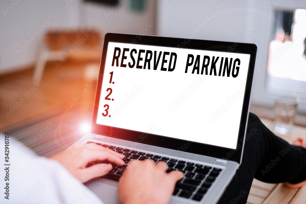 Wall mural conceptual hand writing showing reserved parking. concept meaning parking spaces that are reserved f